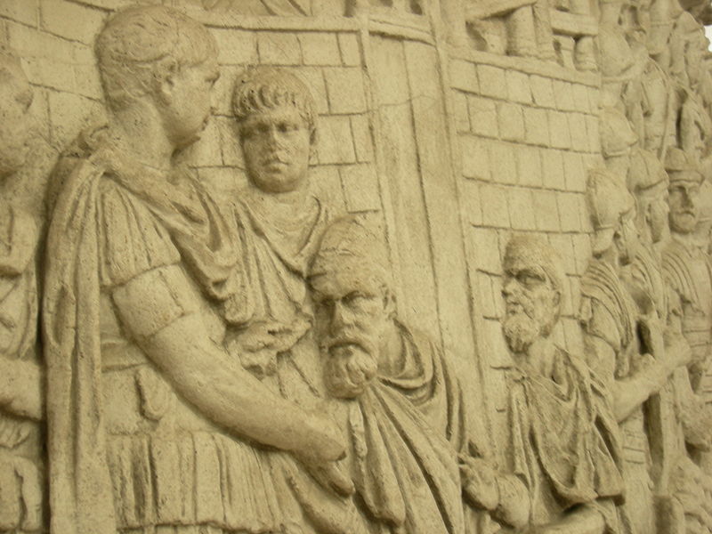 Traian primind aristocraţi (tarabostes sau pileati) de la Decebal (87 – 106).jpg
